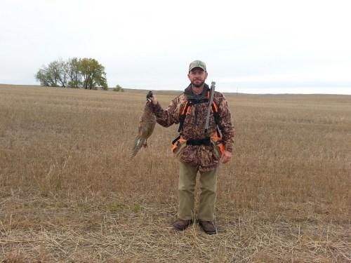 Charles and the first pheasant of the trip.  Photo courtesy of Oscar Hollenbeck