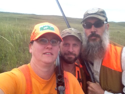 Charity, Charles, and Ryan take a selfie in the grouse field.