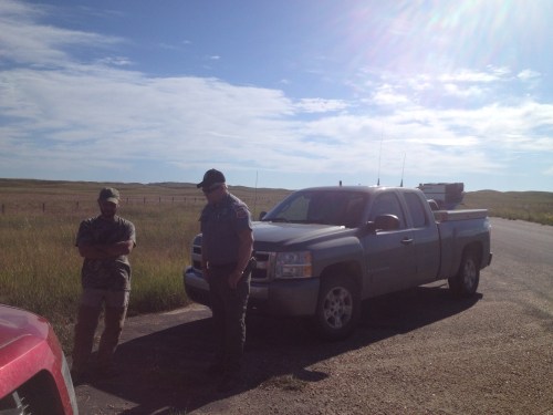 Charles talks to Conservation Officer Frank Miller