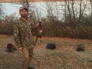 Charles with our one rooster with Fire, Chief and BB back at camp.